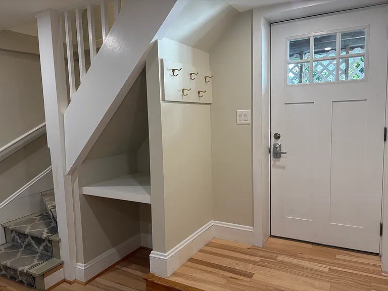 Private entrance leading to flex room and primary bedroom suite.