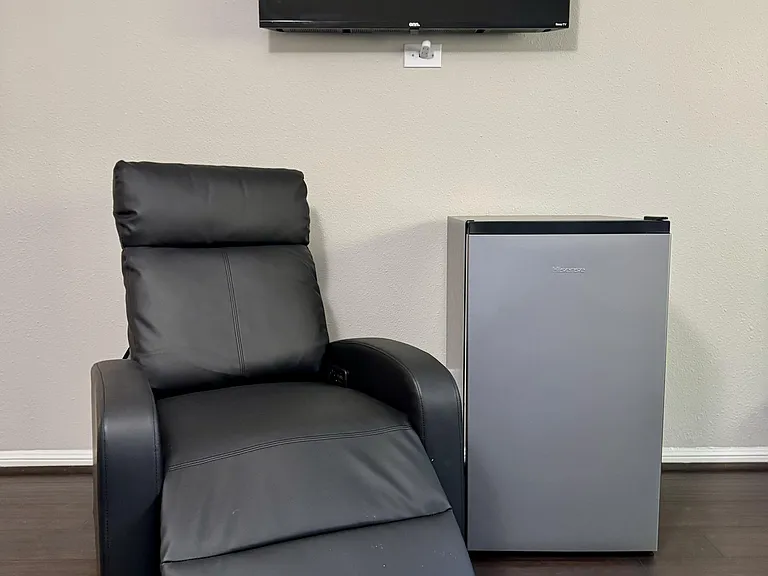 All rooms include a comfy recliner, mini-fridge, and a 40" wall mounted LCD smart TV