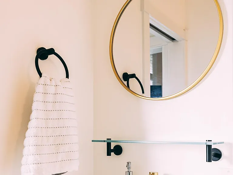 There's a newly refinished bathroom just off the dining room with a standing shower.