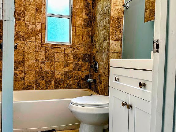 Bathtub, shower, vanity and medicine cabinet/mirror