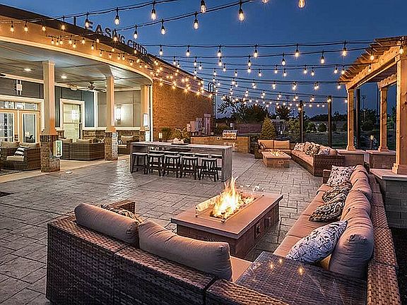 String lights, fire glow, and a chill atmosphere you'll want to come home to. The best kind of nightcap.