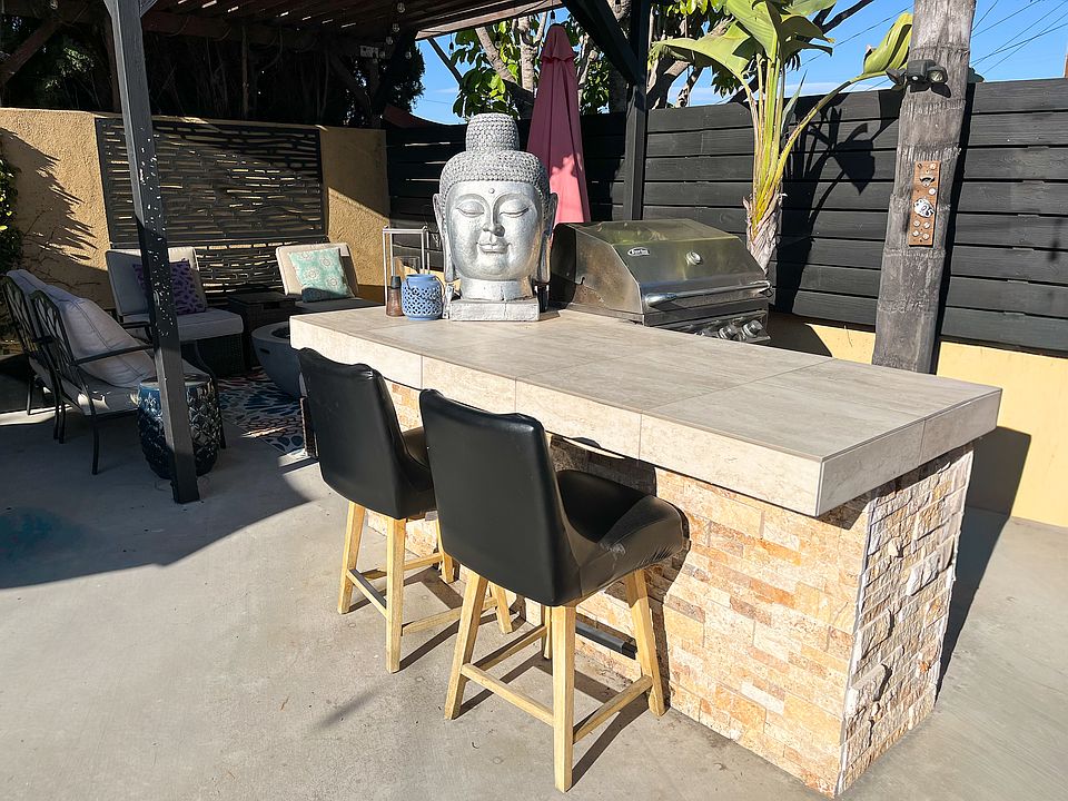 Entertainer's backyard with built-in BBQ and pergola seating - perfect for entertaining.