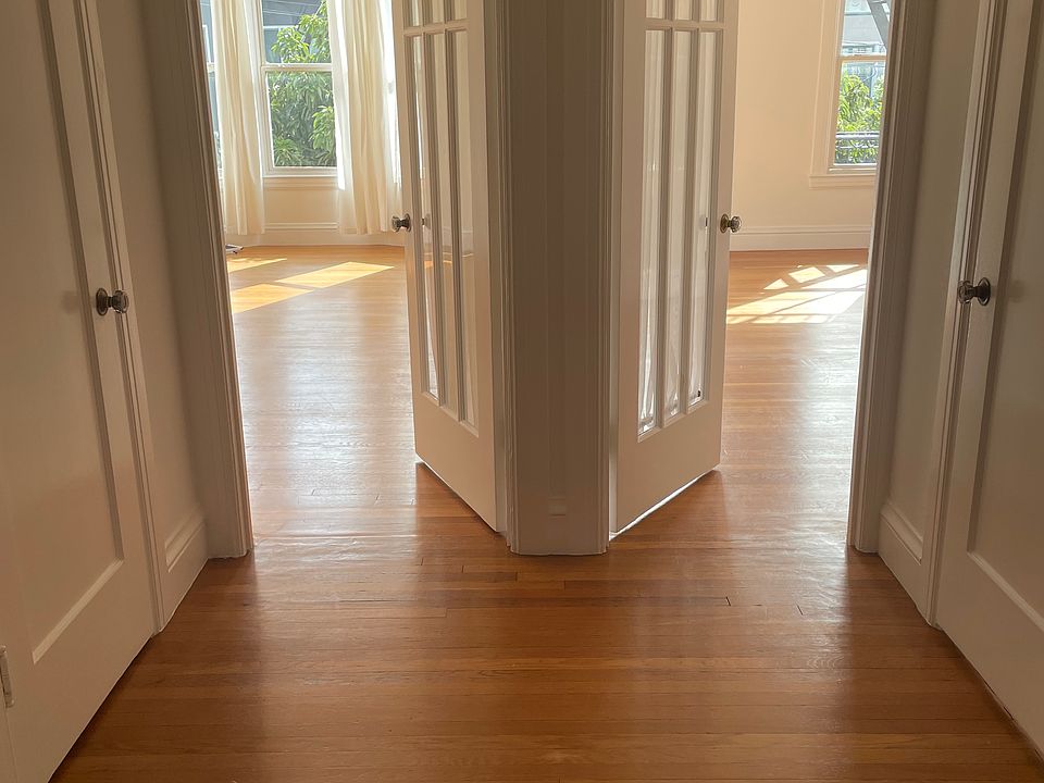 Standing at Entry way living room and bedroom to the right. Two walk-in closets see doors to closets across from each other.