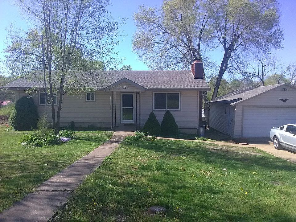 Street view of house with flagpole