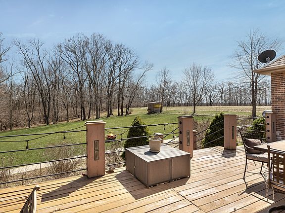 The large yard is easily accessed from the deck. There is additional storage space under the deck lo