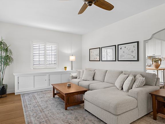 Open floorplan living room with original archways