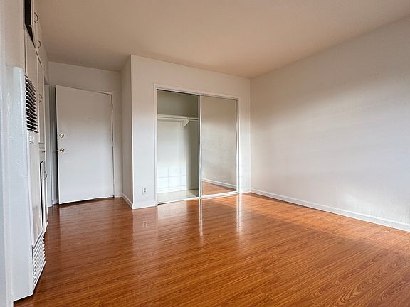 large closet space with double mirror sliding doors