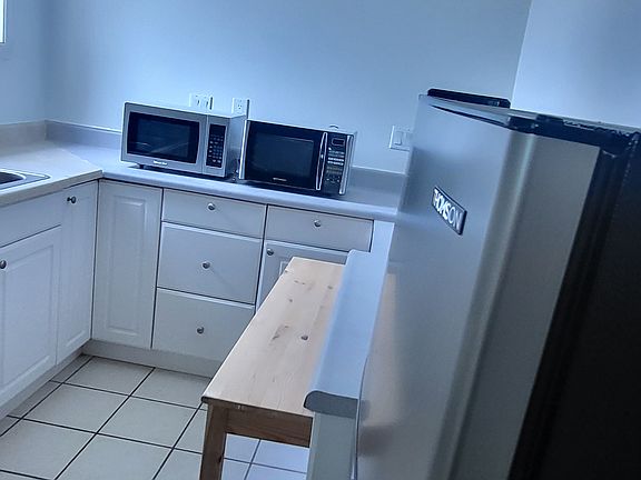 Kitchen with refrigerator