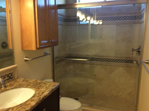 Custom Travertine and Designer done bacsplash