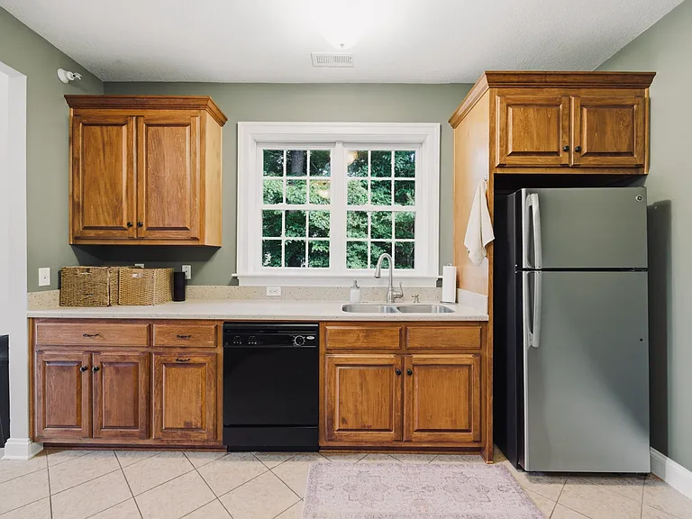 Kitchen window with a wooded view