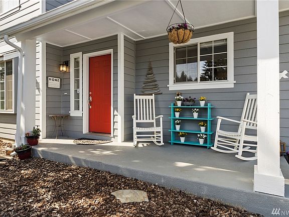 The quaint covered porch is a great space to relax in your rocking chair with a beverage