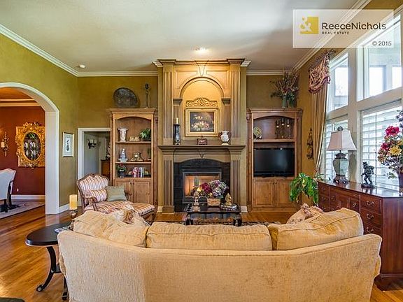 Faux finishes by Architectural Elements are throughout the home as are plantation shutters. The gas fireplace adds great ambiance plus turns on with the flick of a switch.