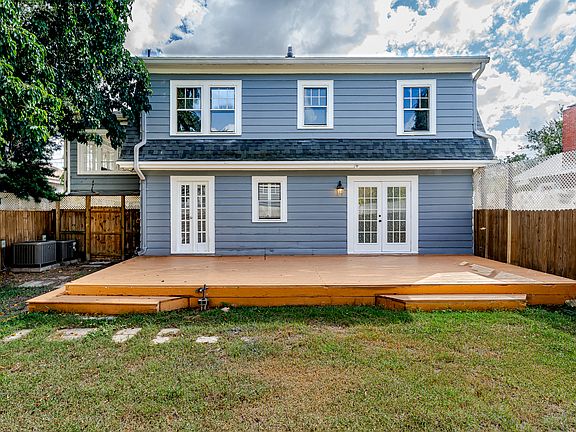 Large Fenced in backyard with privacy lattice