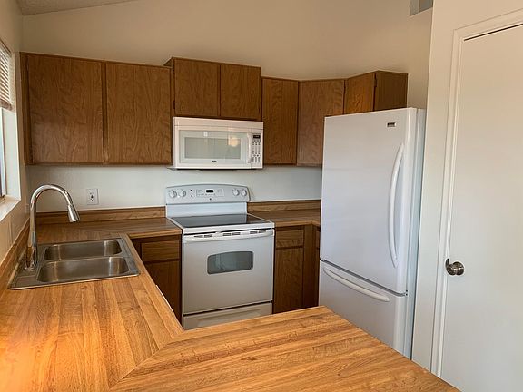 Kitchen overlooking backyard with pantry