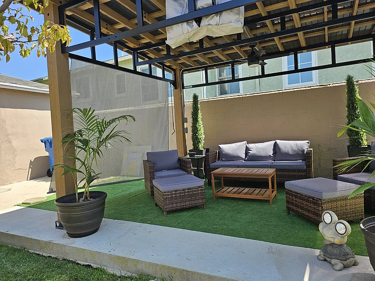 Relax in the backyard under a Gazebo with comfortable lawn furniture while watching TV. There is also a Traeger BBQ grill available when the weather for cooking outdoors is desired.