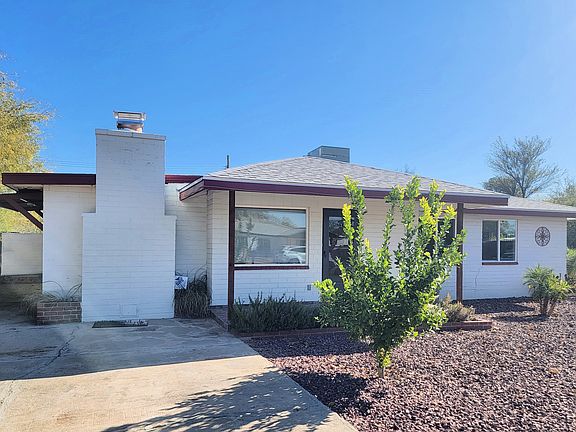 Front of House and Driveway. Paved parking for at least three cars, ample street parking available. Tenant may park up to 1 trailer (18' max) behind rear gate in designated area.