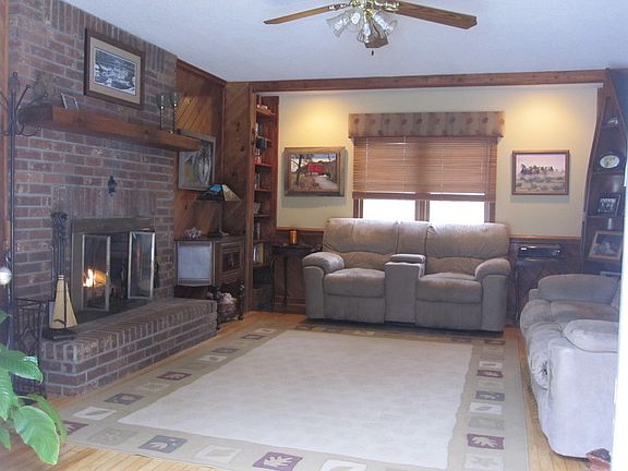Family Room : Gas burning fireplace. Opens to pool area