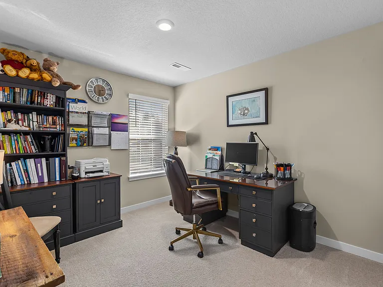 One of three upstairs bedrooms (or office).