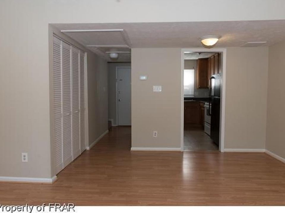 The kitchen has two entrances: the front door and the dining area.