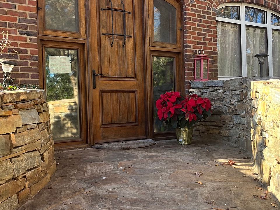 Welcome home. This is one of two, ground-level entrances. This one is via a stone garden room, the other is via the garage.