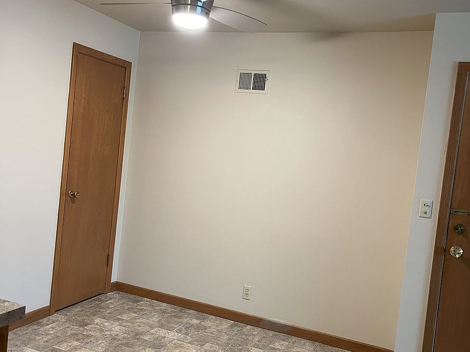 dining area with vinyl flooring for easy clean-up, ceiling fan, coat closet storage
