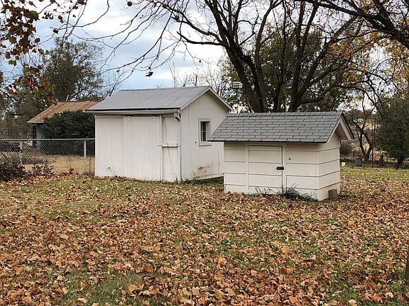 Well house and tin shed. 