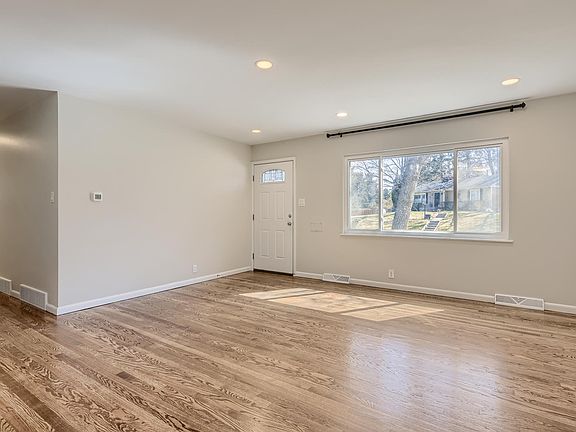 Open concept living room and dining room with tons of natural light.