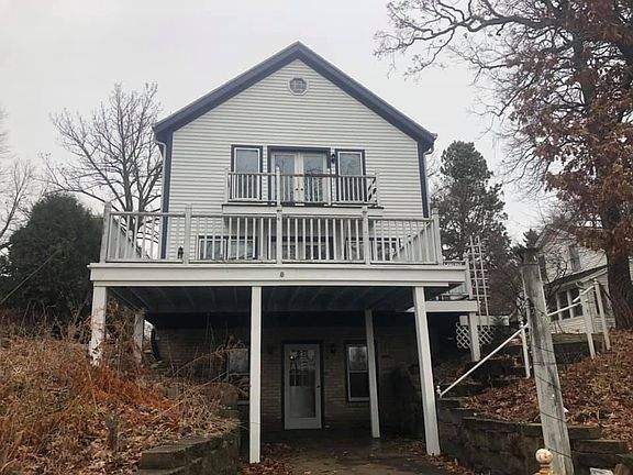 Walk out basement to large bar/rec room with half bathroom