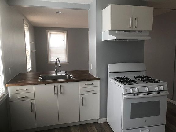 Kitchen looking into living room