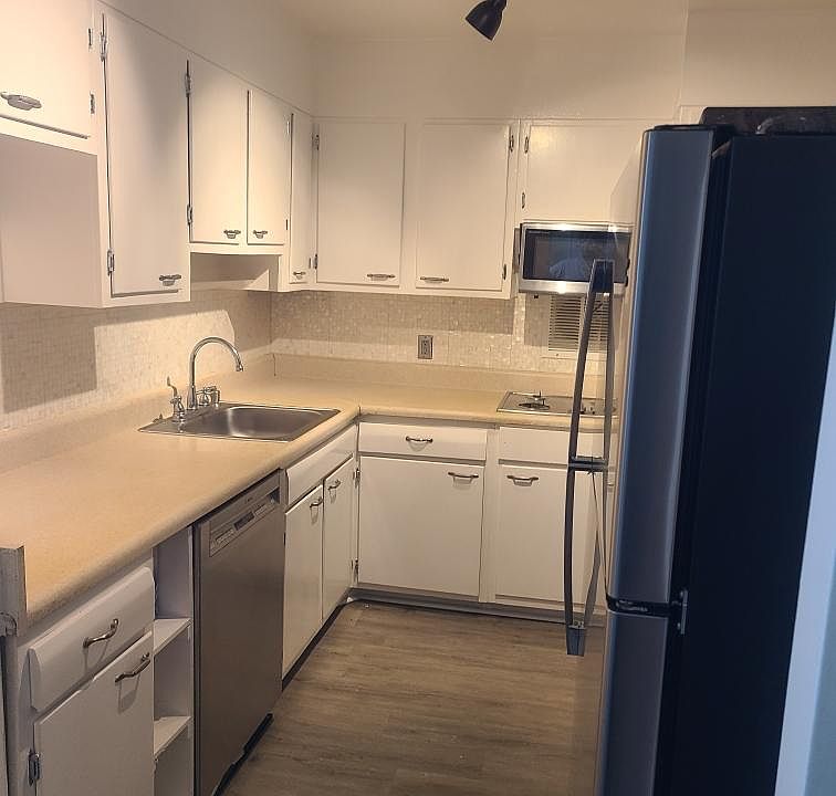 Kitchen (before the new sink and counter). Mother of Pearl backsplash.