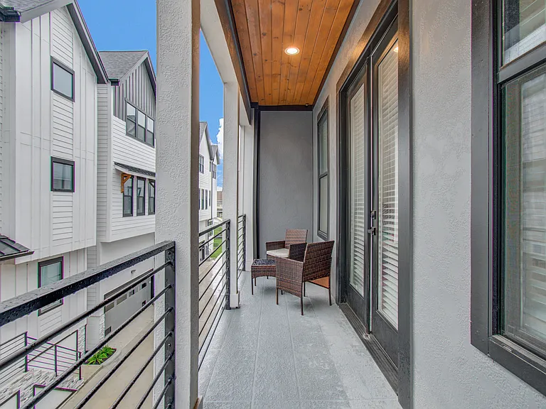 Step outside and relax on your private balcony_the perfect spot to enjoy your morning coffee or unwind after a busy day at the Texas Medical Center.