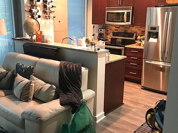 Wine and dine with this open kitchen and living room with a patio (patio furniture includes) that overlooks the city.