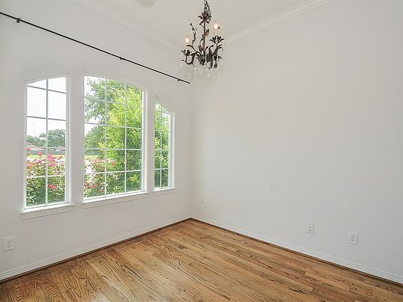 The study has ample natural light. hard wood floors and a lovely view to the front.