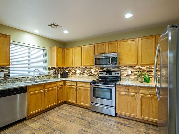 ALL Stainless Steel Appliances, Tile back-splash, under cabinet lighting, usb outlet, & Ceramic wood plank tiling 1