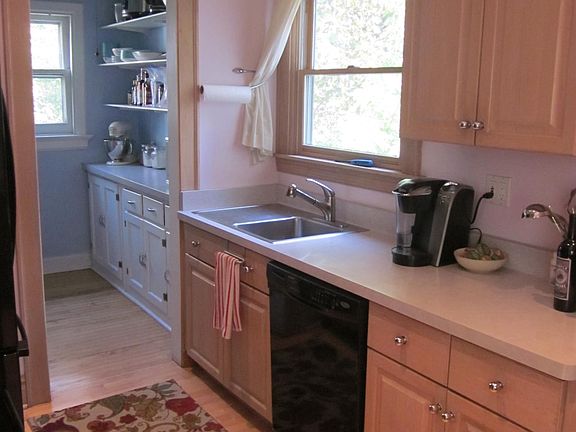 The kitchen has an adjacent walk-in pantry.