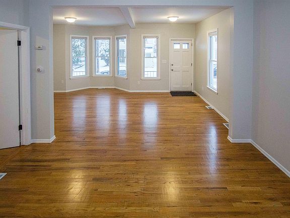 Expansive living room and dining room with newly refinished