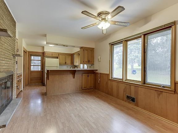 Dining and kitchen flow together as one w/the reverse side of the see-through fireplace