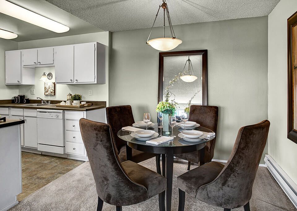 Dining area with overhead lighting and easy access to the kitchen