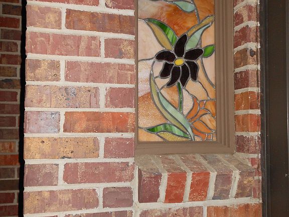 Stain glass on ea. side of entry
