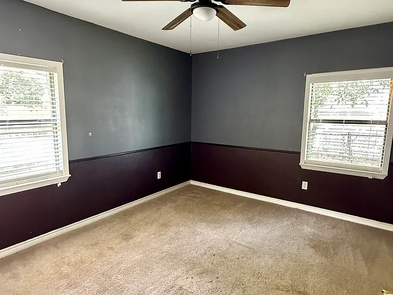 Primary Bedroom:
Generously sized primary bedroom with accent wall and built-in closet.