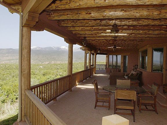 Two doors lead to a huge portal on the North side of the home. The views are magnificent, and range 