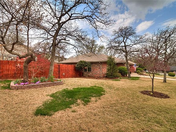Just coming around the corner to your new home. Notice the little doggie peep hole on the fence.