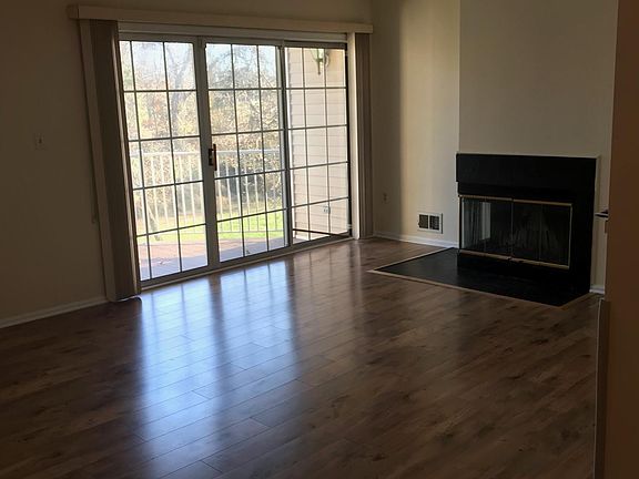 Living Room with Fire Place and Walk out Balcony/Deck