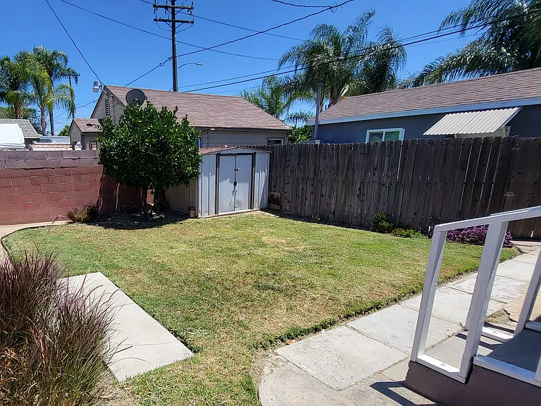 Private Fenced Backyard with Grass