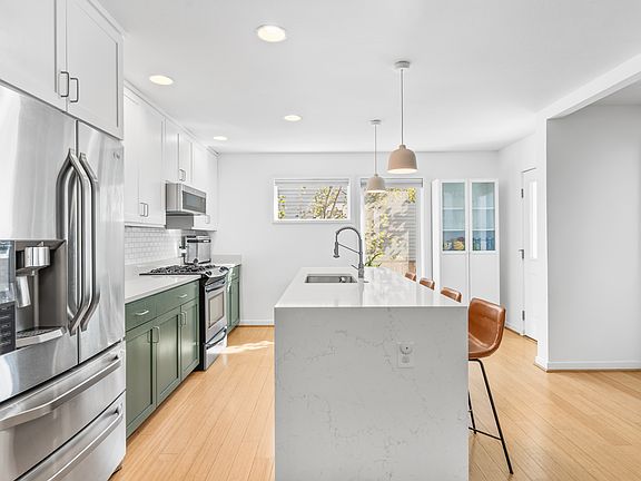 Newly updated quartz countertops and stainless steal appliances with built in microwave