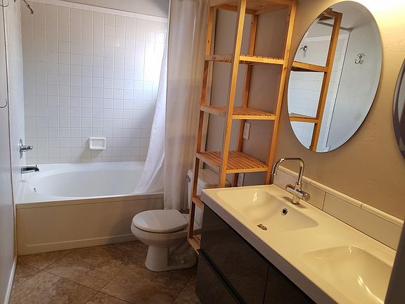Master bathroom with oversize bathtub.