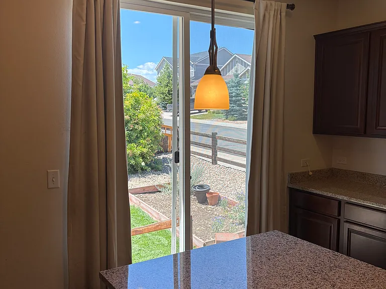 Kitchen to back yard and raised garden