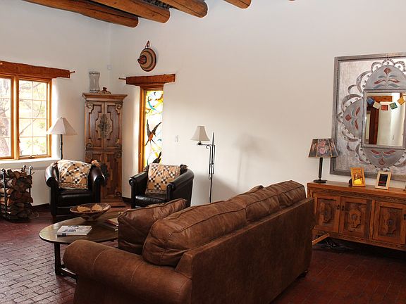 Living room area has stained glass windows