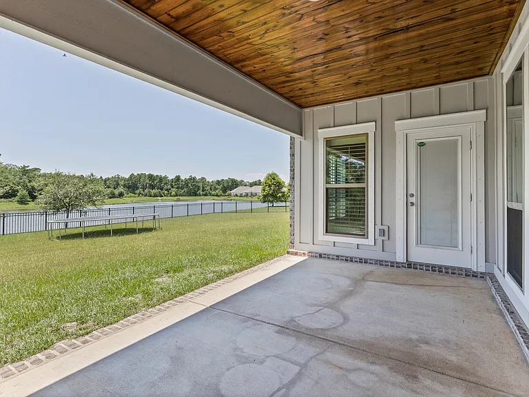 Covered patio overlooking pond