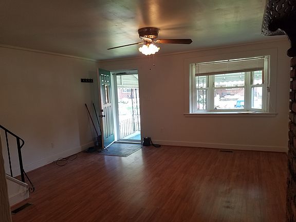 Stone entry and large bay window
